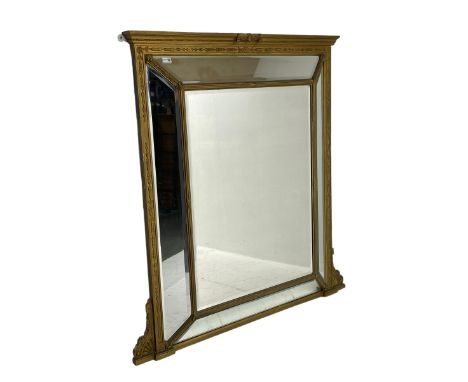 19th century giltwood and gesso cushion framed mirror, the frame decorated with trailing flower heads, fitted with fan and sc