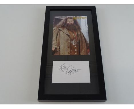 HARRY POTTER: A framed and glazed ROBBIE COLTRANE display of photograph as Hagrid and signed card - PROVENANCE:  The Alex Bro