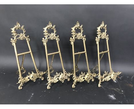 19th Century English School. An Ornately Cast Brass Easel, 21.25" x 9.5", and three companion pieces, a set of four (4).