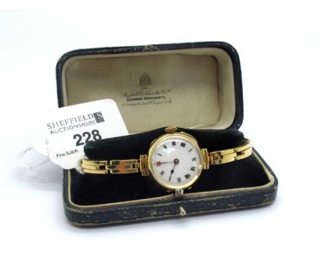 A Vintage 18ct Gold Caased Ladies Wristwatch, the white dial with black and red Roman numerals, movement stamped "Made In Swi