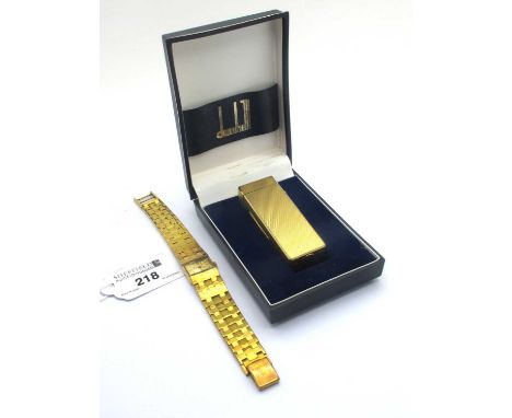 Dunhill; A Vintage Gold Plated Lighter, allover textured finish, stamped "Dunhill Made In Switzerland US.RE24163 Patented", i