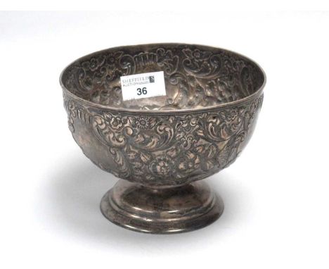 A Chester Hallmarked Silver Footed Bowl, Nathan &amp; Hayes, Chester 1897, allover detailed in relief with flowerheads and le