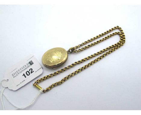 An Antique Oval Locket, allover engine turned, on reeded belcher link chain.No visible markings to confirm metal, total weigh