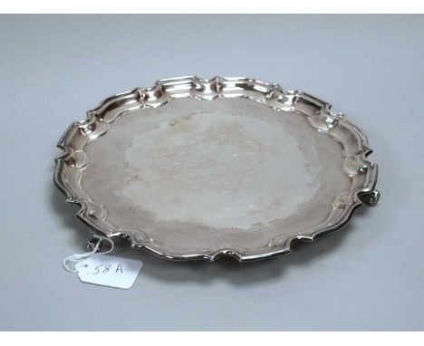 A Hallmarked Silver Salver, FH, Birmingham 1972, of shaped circular form with engraved presentation inscription "W.G. Hall a 