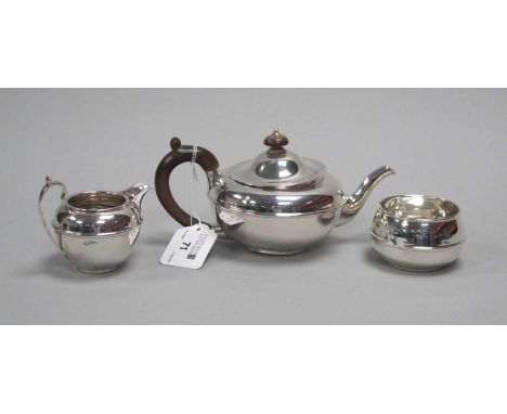 A Hallmarked Silver Three Piece Bachelor's Tea Set, C&amp;R C, London 1921, each of plain circular form, the teapot with pull