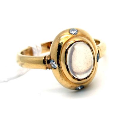 An Antique Style Moonstone and Diamond Ring, oval cabochon collet set to the centre, with brilliant cut diamonds rubover set 