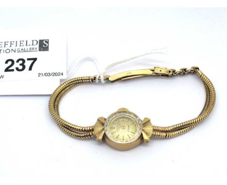 Rotary; A 9ct Gold Cased Ladies Wristwatch, the signed dial with line markers within shaped case, to integral two row smooth 