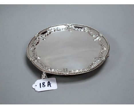 A Georgian Hallmarked Silver Card Tray, (makers mark rubbed) London 1774, detailed in relief with swags within beaded border,