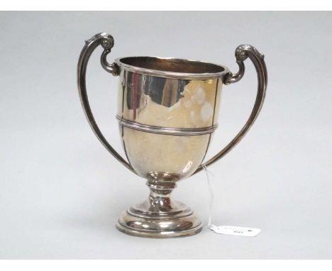 A Hallmarked Silver Twin Handled Trophy Cup, B&amp;FLtd, London 1922, of plain design with twin leaf capped scroll handles, o