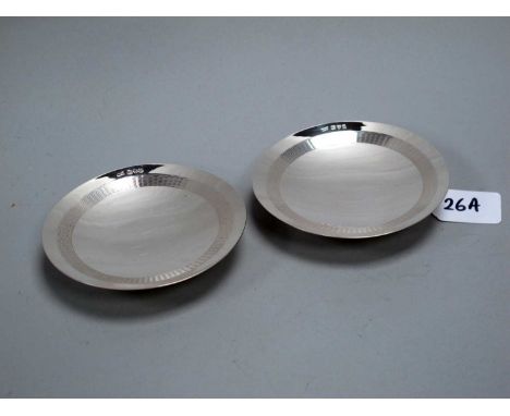 A Pair of Hallmarked Silver Dishes, Walker &amp; Hall, Chester 1939, each of shallow circular form with engine turned detail,