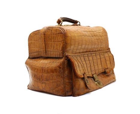 A crocodile skin Gladstone bag, with decorated brass hinges and buckles, 41 cm wideCondition report: In fair condition, the i