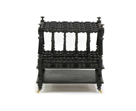An ebonised four division canterbury, with a shelf below, raised on castors, 46.5cm, 34.5cm deep, 51cm highCondition report: 