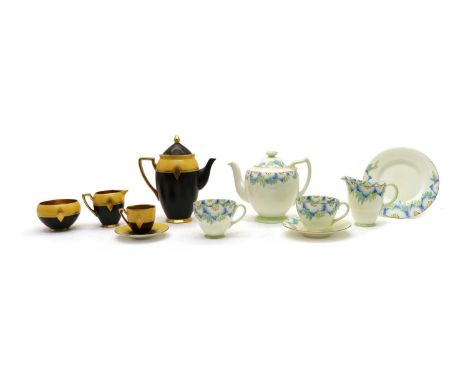 A Carltonware Art Deco coffee set, in mustard and black with gilt details, comprising five cups and saucers, a cream jug, sug