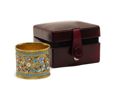 A champleve napkin ring, the gilt metal ground with applied foliate decoration in blue, white and red, 3.5cm highCondition re