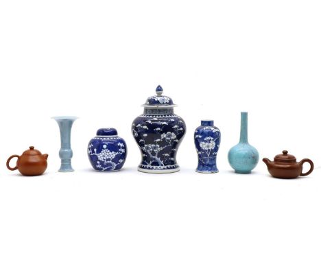 Three Chinese blue and white vases, comprising one of ovoid form, 12cm high, one of baluster form, four-character Kangxi mark