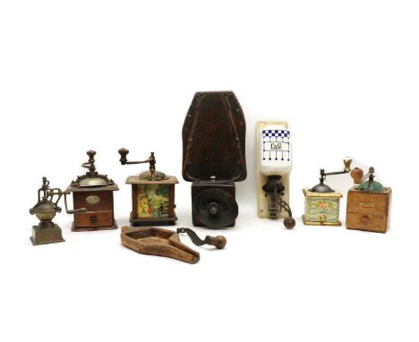 A rustic walnut and iron moulin or coffee grinder, 19th century with shaped board base and single drawer, 22cm wide, 50cm lon