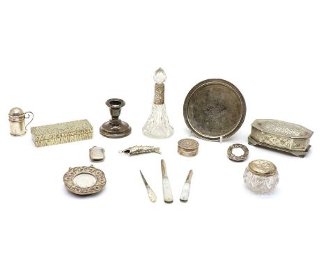 A collection of silver and silver plated items, comprising two mother of pearl handled fruit knives, a silver pepper pot, a s