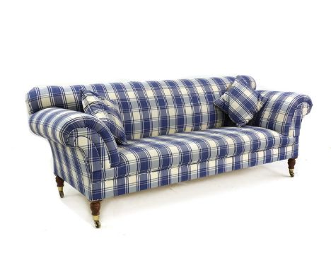 A modern chequered-upholstered Chesterfield-style sofa, of recent manufacture, raised on turned supports terminating in brass