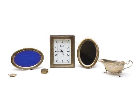 A silver cased Harrods boudoir clock, the inscribed white dial with Roman numerals, 17cm high, together with a silver sauce b