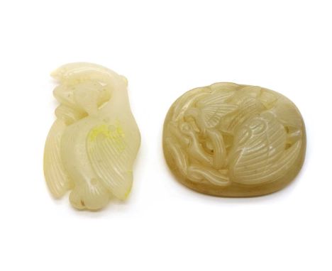 A Chinese jade plaque, carved with a wild goose fighting with an eagle, 6cm long, and a hardstone carving, similarly decorate