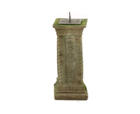 An early 20th century sundial, with an engraved surface with Roman numerals, raised on a composite plinth with foliate motifs