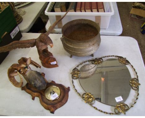 A mixed lot of items to include: Mid Century Mirror, Cast metal planter, carved wooden eagle and a Novelty Plastic Barometer 