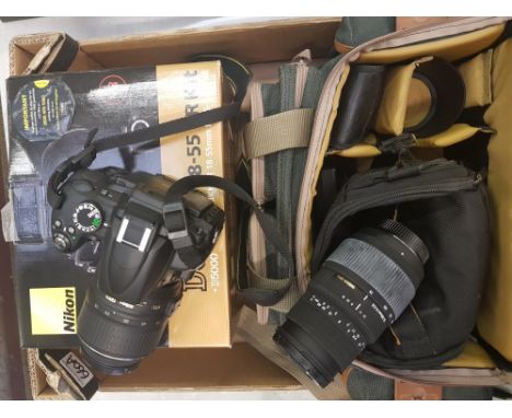 A Nikon DS5000 18-55mm digital camera: together with a Sigma 70-300mm lens, carry case, accessories and original box. 