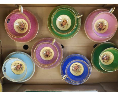 Seven Aynsley Orchard Gold cup and saucer sets: with coloured borders, light blue, blue, 2 x green, pink, cerise and purple (