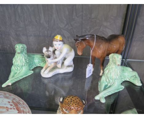 A pair of Sylvac figures of seated dogs, a Russian figure of a boy and dog, and a Beswick horse, as found