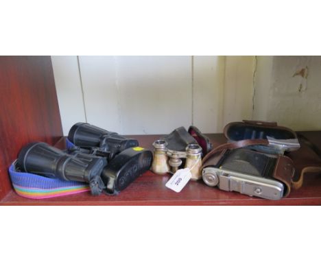 A pair of mother of pearl opera glasses, a Voitlander Perkeo II camera and a pair of Optolyth 10 x 50 binoculars