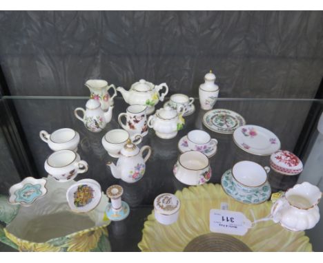 A collection of doll's house china tea services and vases, by Coalport, Spode, Royal Worcester and others