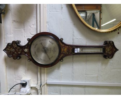 A Victorian rosewood banjo barometer, inlaid in brass and mother of pearl, retailed by W. Ladd &amp; Co. Regent Street, 199 B