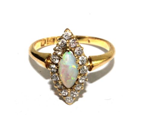 A diamond and opal ring