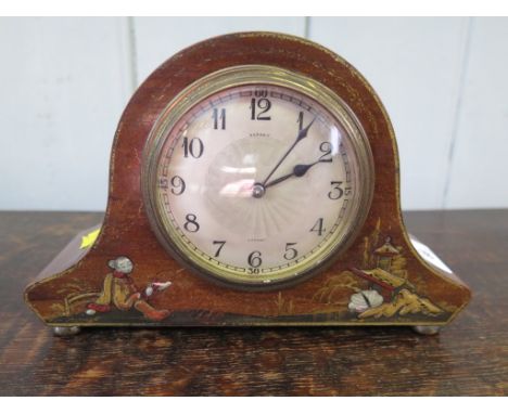 A 1920s mahogany mantel clock retailed by Asprey, London, the silvered engine turned dial within a chinoiserie decorated case