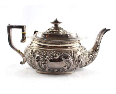 A Victorian silver teapot highly decorated in relief, Birmingham 1899