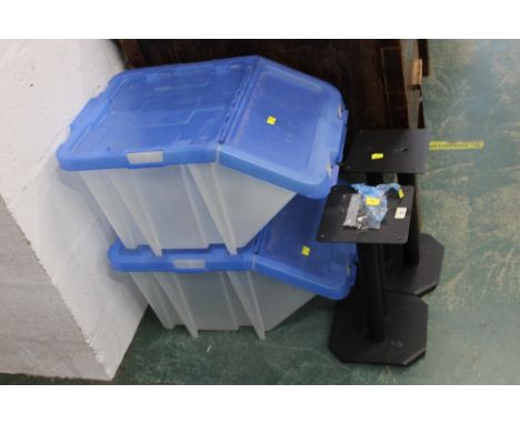 Two plastic storage bins and pair of speaker stands 