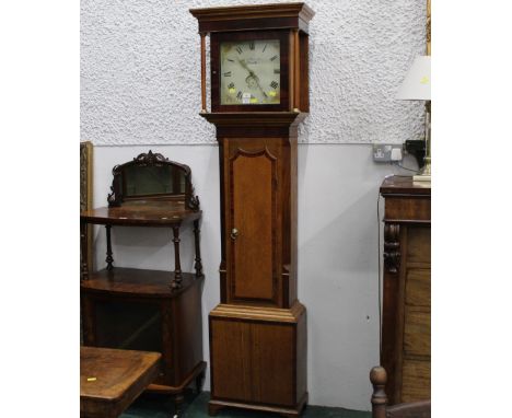 A 19th century oak longcase clock by George Martin Roper of Penrith, with white enamelled dial and floral decoration, the oak