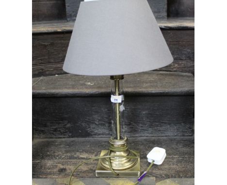 Decorative table lamp and shade with clear glass column  