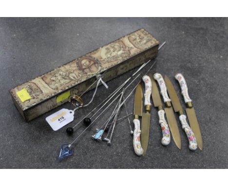 Vintage tin of knives with ceramic handles and hat pins