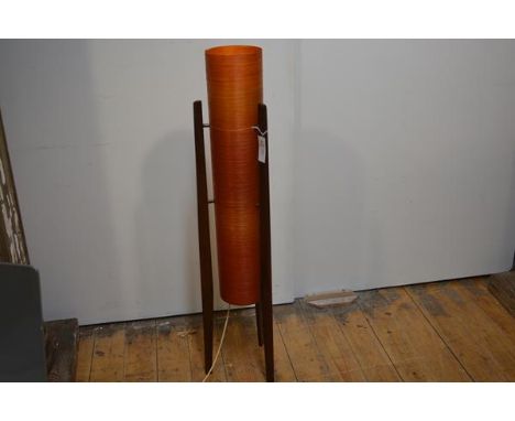 A 1960's floor standing rocket lamp, raised on three tapering teak legs and with orange fibreglass shade. 105cm
