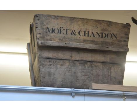 A very large wooden planter, printed Moet & Chandon. 54cm by 70cm by 60cm