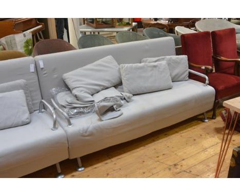 An Italian contemporary sofa bed by BBB Emmebonacina, in grey, with fold out seat and raised on white metal legs, together wi