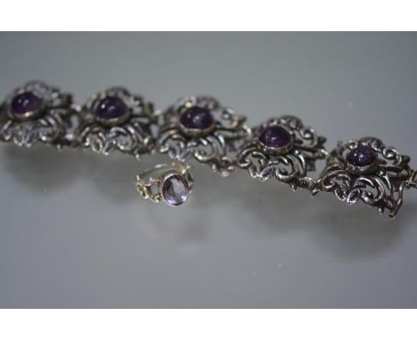 A substantial Mexican sterling silver bracelet mounted with five amethyst cabochons; together with a single stone amethyst ri