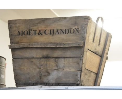 A very large wooden planter, inscribed Moet & Chandon. 54cm by 70cm by 60cm