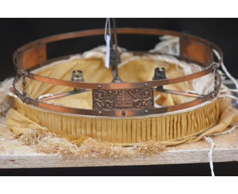 An Edwardian copper rise and fall ceiling light, with fabric and tassel shade, with weight. Length 48cm