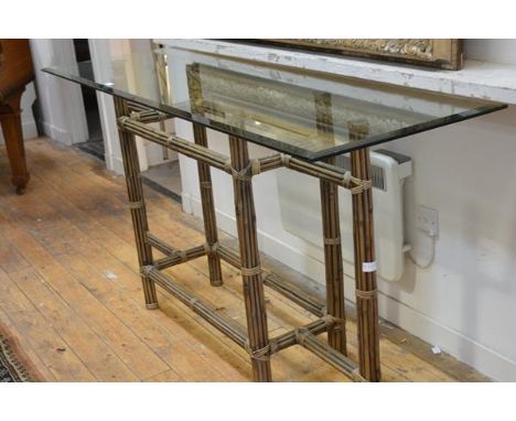 A bamboo and glass console table, the rectangular bevelled top raised on clustered bamboo legs. 90cm by 180cm by 60cm