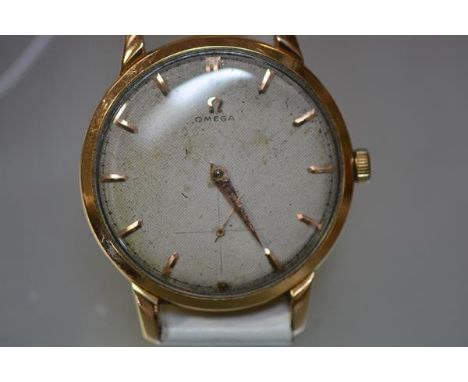 A vintage gentleman's Omega 18ct gold wristwatch, the dial with baton numerals and subsidiary seconds dial (one hand missing)