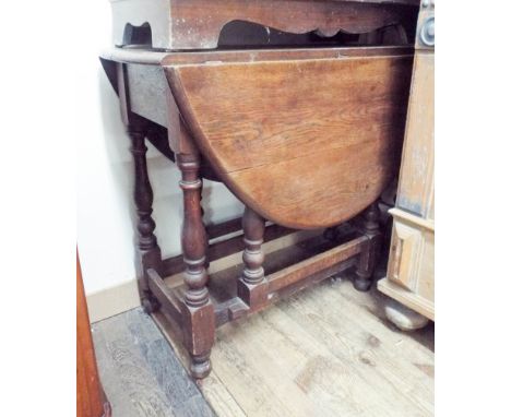 An oak gate legged dining table 