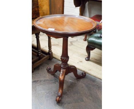 A reproduction mahogany tripod table 