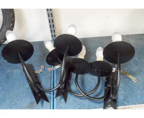 Three Jim Lawrence black wrought iron wall light fittings, two shepherd crook style wrought iron curtain poles and others. 